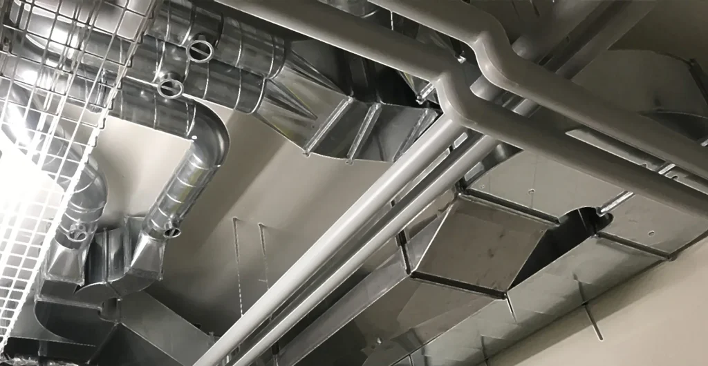 Réseau de ventilation posé par Carroz SA — gaines galvanisées et diffuseurs